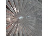 a close up of a glass plate with a circular design
