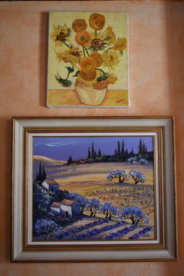 painting of sunflowers in a vase and a painting of lavenders in a vase