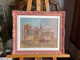 a picture of a painting on a easel in a room