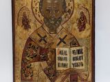 an old wooden icon of st nicholas the great