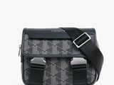 sac à bandoulière noir et blanc avec une bandoulière noire