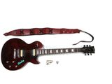 une sangle de guitare qui se fixe au manche de la guitare