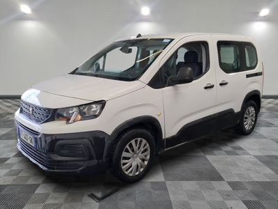 the white van is parked on a checkered tile floor