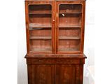 a large wooden cabinet with glass doors and drawers