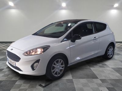 the white car is parked on a checkered floor in the garage
