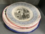 several plates are stacked on top of each other on a shelf