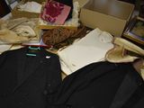 a pile of clothes and other items on a table