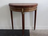 an image of a small wooden table with a marble top