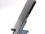 a cell phone that is sitting on top of a stand