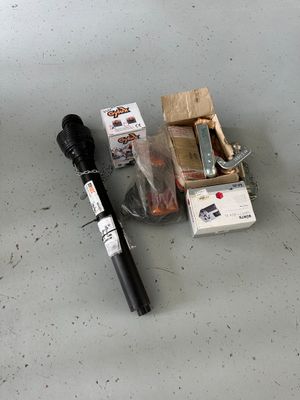 a picture of the contents of a flashlight and a box of cigarettes