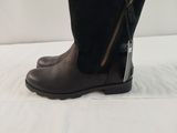 black boots with zippers on the side and a zipper on the inside