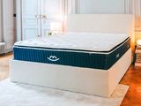 an image of a mattress on a bed frame in a bedroom