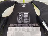 the back of a life jacket with instructions on it sitting on a table