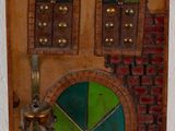 a small wooden door with a window and a door handle on it