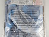 a bag with a pair of scissors in it on a table
