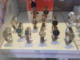 a lot of watches on display in a glass case