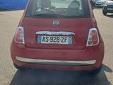 a red car that is parked in a parking lot