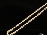 un collier de perles et de diamants, par entreprise