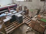 a pile of boxes on a pallet in a room
