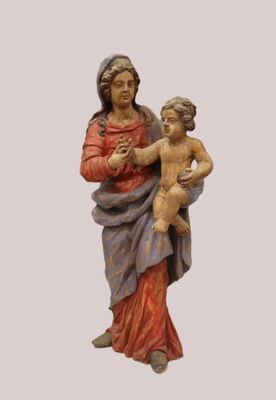 an image of a statue of a woman holding a child