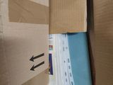 a cardboard box that has a bunch of papers inside of it
