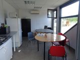 a kitchen with a table and chairs in it