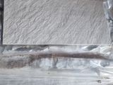 un morceau de bois emballé dans du plastique