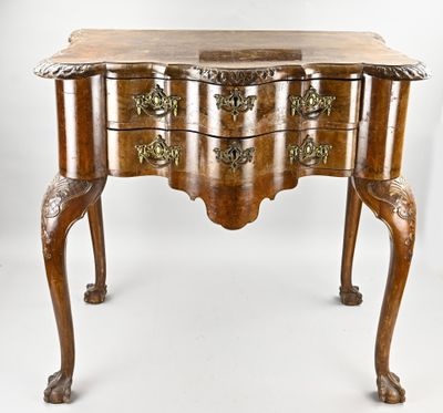 an old wooden table with a drawer on top of it