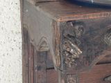 a wooden cabinet with a metal bowl on top of it