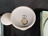 a plate and a cup sitting on a table