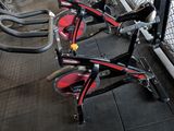 many bikes that are lined up in a row
