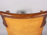 an image of a wooden chair with a yellow seat