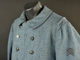an image of a blue peale coat on a mannequin