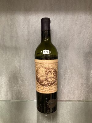 a bottle of wine that is sitting on a glass shelf