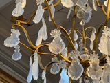 a chandelier hanging from the ceiling in a room