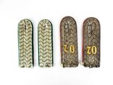 three pairs of wooden shoes with numbers on them sitting next to each other