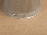 a white candle that is sitting on a table