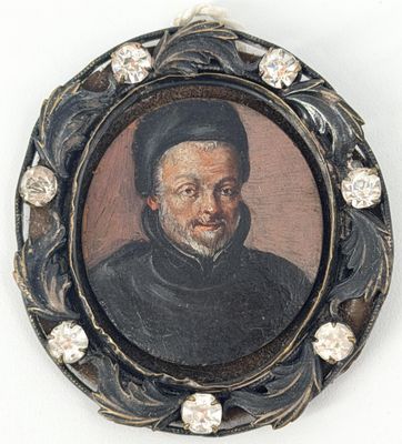 portrait d'un homme portant un chapeau noir et un manteau noir