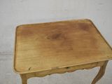 a small wooden table with a drawer underneath it