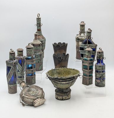 a lot of silver objects that are on a table