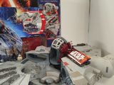 star wars toys sit on a shelf next to a box of candy