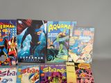 a lot of comic books sitting on a table