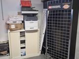 a metal rack that has a bunch of boxes on it