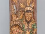 an old wooden carving of a man holding a baby and a bird
