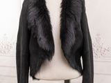 the jacket is black and has a fur collar on it