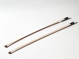 a pair of wooden chopsticks on a white background