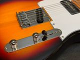 a close up of a guitar that is sitting on a table