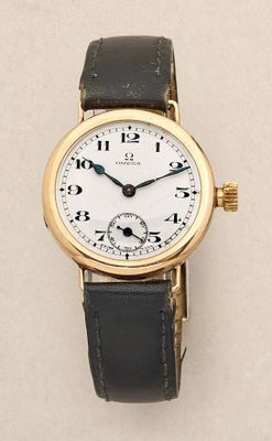 a close up of a wrist watch on a white surface