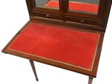 a small table with a mirror on top of it