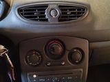a dashboard of a car with a steering wheel and dashboard controls